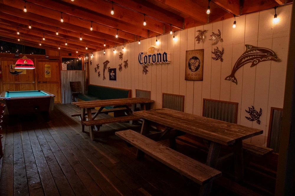 Guests enjoying the illuminated night pool at Ocean Cove Lodge